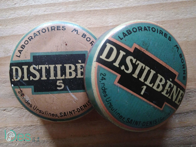 <p>Red and blue Distilbène medicine boxes. Each tablet contain 1 mg and 5 mg diethylstilbestrol by M Borne laboratories.</p>